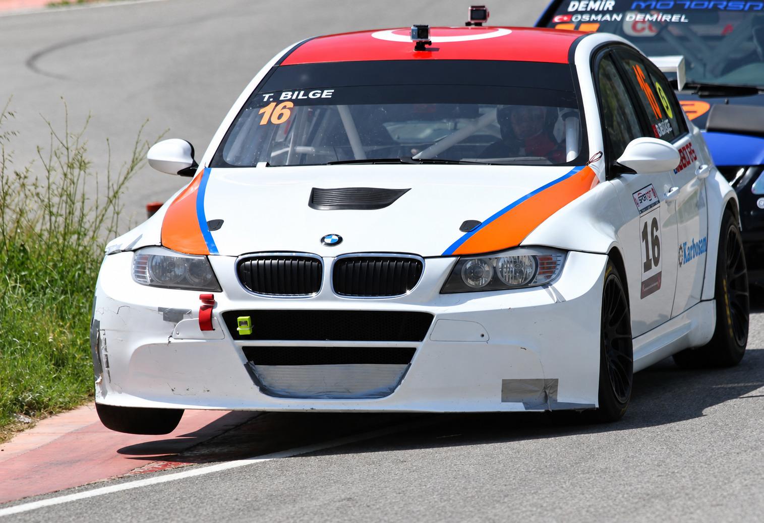 Tahir Bilge’s No. 16 BMW racing through a corner in the Turkish Track Championship